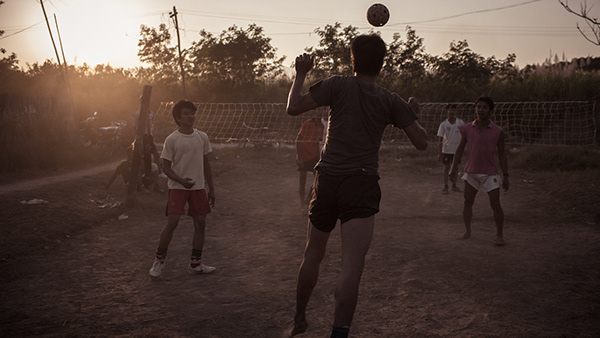 Children playing outdoors in evening light