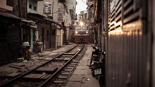 A train passing through the neighborhood. Hanoi, Vietnam