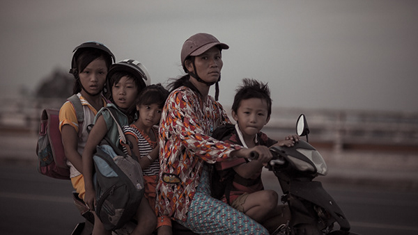 Family riding together on a motorcycle