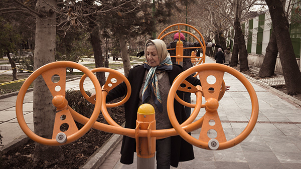 Orange exercise wheels in an outdoor park