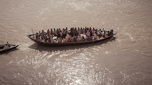 Passenger boat crossing a wide river