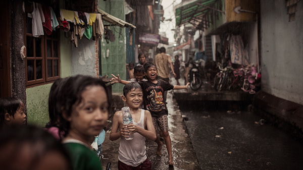 Children gathered in a narrow residential lane