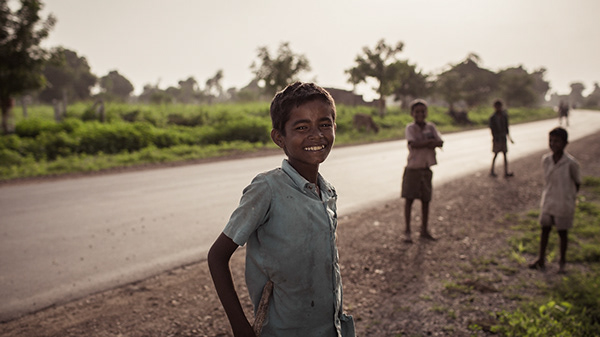Children beside a quiet rural road